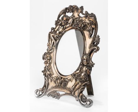 *Photograph Frame. A Continental Rococo style white metal frame, probably circa 1910,  finely embossed with a little girl and