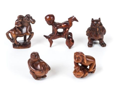 *Netsuke. A collection of Japanese carved wood netsuke,  including a monkey holding a nut, signed base, 4.5cm high, another a
