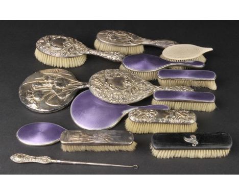 *Dressing Table Sets. Continental silver three piece dressing table set,  comprising mirror and two brushes, embossed with st