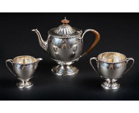 *Tea Set. An Edwardian silver three-piece tea set, makers mark worn, London 1909,  of classical form, the teapot with fruitwo