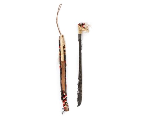 *Sword. Indonesian Dyak head hunters sword,  57cm shaped steel blade, bone grip bound with cord, 71cm overall, in its scabbar