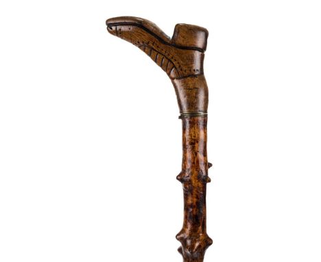 *Walking Stick. An Edwardian folk art walking / swordstick,  the handle carved as a boot, the shaft a natural wood probably h