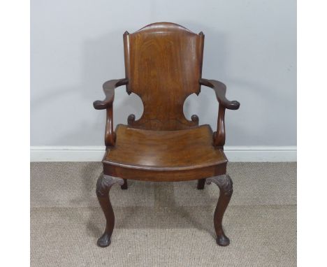 An unusual Georgian possibly Irish mahogany Armchair, with paper scroll back and dished panel seat, raised on cabriole legs c