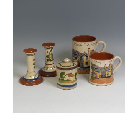 A Devon ware pottery St. Ives Mug, depicting the 'Sloop Inn (1312)', together with another St. Ives Mug, a pair of Devon ware