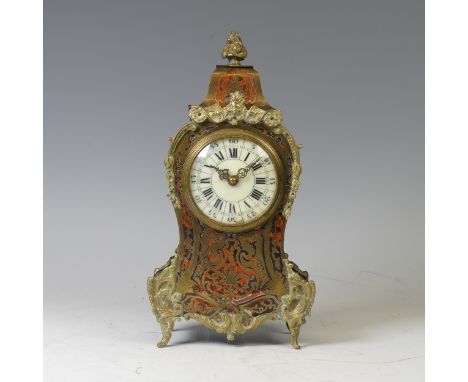 A late 19th century French brass mounted and red tortoiseshell Boulle mantel Clock, the white enamel dial with Roman hour mar