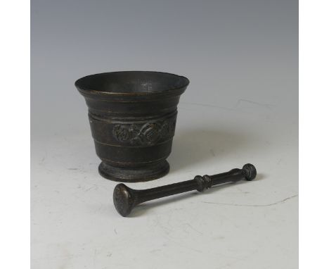 An antique bronzed Pestle and Mortar, H 11.5 cm.