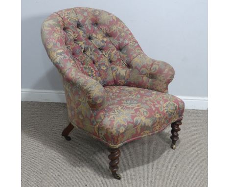 A Victorian button-back upholstered tub Armchair, raised on barley twist supports and brass caps and castors, W 71 cm x H 87 