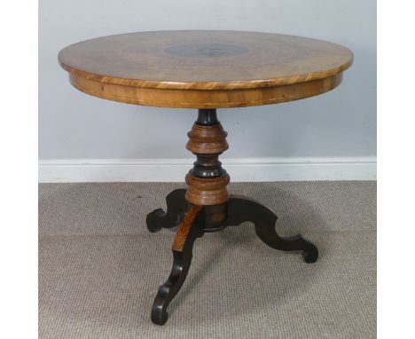 A late 19th century Italian Sorrento marquetry centre Table, the circular top with centralised marquetry and ebonised panel d