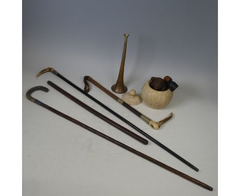 A Swaine style hunting Whip, together with three other walking sticks, two of which with silver mounted collars, also with a 