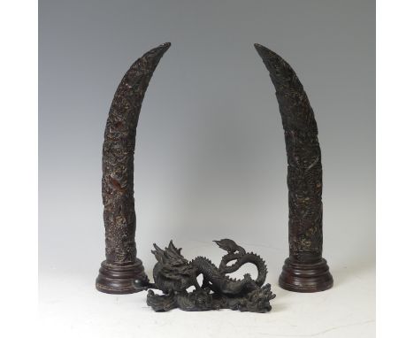 A 20th century Chinese bronze Dragon, L 33cm, together with a pair of Chinese style horn shaped resin Carvings, stained too a