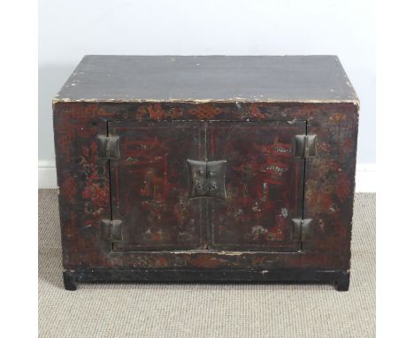 An antique Chinese black lacquered and red painted Chest/Trunk, probably 19th century, with two small cupboard doors conceali