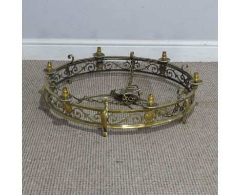An antique brass Chandelier/ceiling Light, of a circular design decorated with pierced scrolls, W 60 cm.