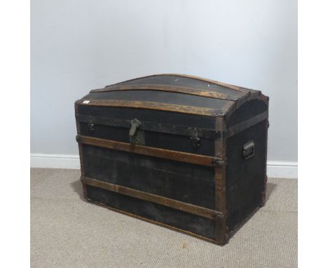 A 19th century pine dome-top oak and metal bound travelling Trunk, with original fitted tray top interior and metal carrying 