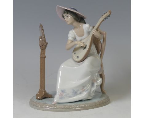 A boxed Lladro figure of 'Sweet Song', 6408, signed on base, H 21 cm.