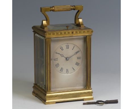 A late 19th century French gilt brass repeating carriage Clock, the silvered dial with Roman numerals, the movement striking 