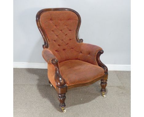 A good Victorian mahogany show-frame button-back Armchair, with serpentine seat raised on William IV style turned and reeded 