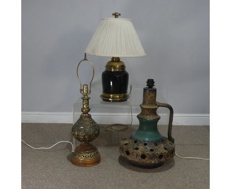 A large West German pottery Lamp, H 50 cm, together with a Persian style gilt metal Lamp, H 72 cm, and another Lamp, H 60 cm(