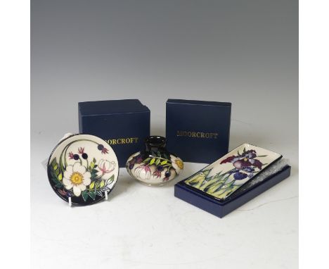 A Moorcroft pottery ‘Duet’ pattern pin tray, 2005, by Nicola Slaney, painted and printed marks, 20cm long, with original box,
