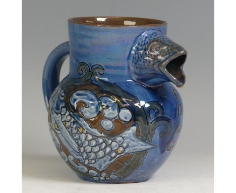 A C. H. Brannam pottery fish Jug, decorated in blue ground with incised verse 'From the rocks and the sands..' with fish deco