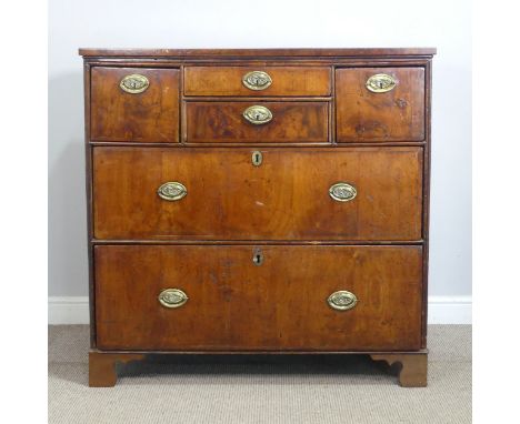 A Georgian mahogany Chest of drawers, with two short central drawers flanked by square drawers to either side, above two long