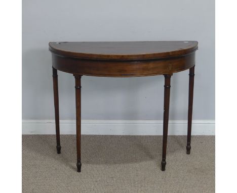 A 19th century mahogany demilune card Table, with ebonised stringing and raised on turned tapering supports, W 92 cm x H 71 c