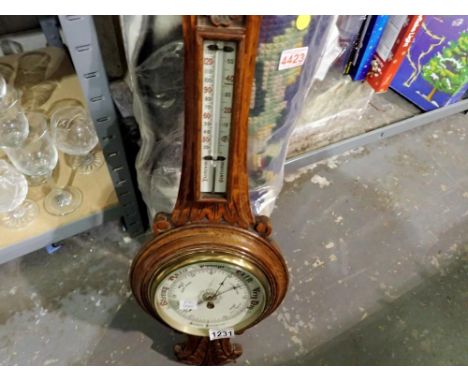 Carved oak aneroid barometer, c. 1880. H: 72cm. Not available for in-house P&amp;P