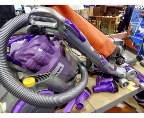 Dyson vacuum cleaner with manual and accessories. All electrical items in this lot have been PAT tested for safety and have p