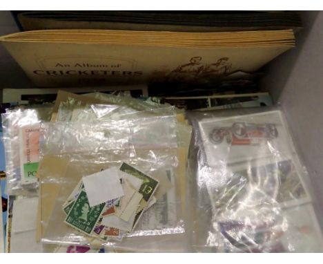 Box containing mixed stamps, postcards and cigarette cards. UK P&amp;P Group 2 (£20+VAT for the first lot and £4+VAT for subs