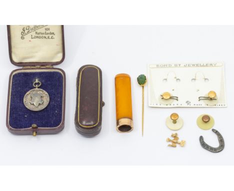 A collection of early 20th century items to include a 9ct gold mounted amber type cheroot holder, length approx 60mm, in a le