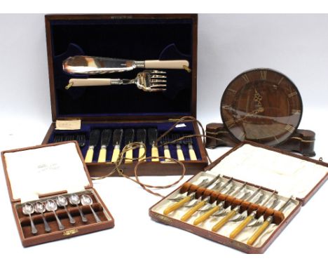 A cased set of silver-plated ivorine-handled fish knives, forks and servers; a cased set of cake forks and knives, and a case