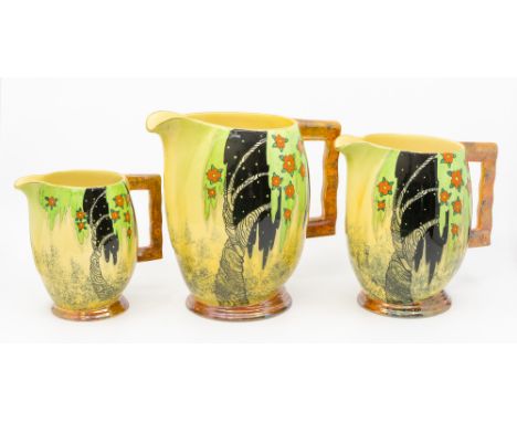 3 graduated Carlton Ware 'Spangle Tree' pattern jugs with stylised tree and flower decoration. Jug heights approx. 19.5cm, 17