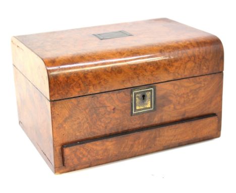 A 19th century burr walnut vanity box with sloped top with central cartouche, interior cover with green velvet lining, interi