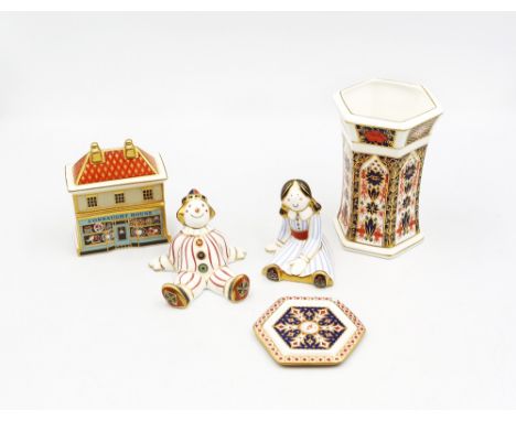 A collection of Royal Crown Derby items to include special edition China shop, rag doll, stripy clown, Christmas tree decorat