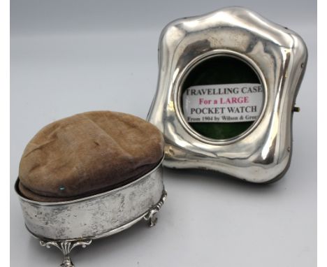 An Edwardian silver pocket watch holder, with leather easel back, silver frame hallmarked by Wilson & Green, Birmingham, 1904