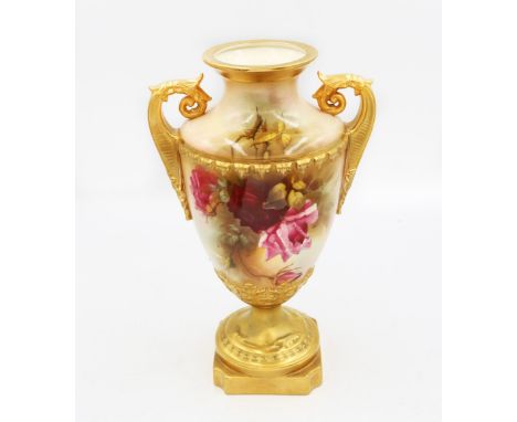 A Royal Worcester twin handled urn shaped vase in floral design with gilt detail, signed by painter J. Llewellyn, purple mark