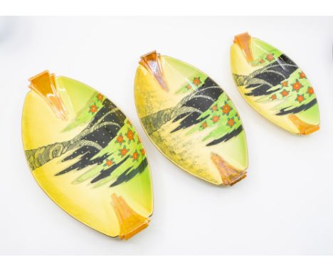 3 graduated Carlton Ware 'Spangle Tree' pattern oval dishes with stylised tree and flower decoration. Sizes approx. 32cm, 27.