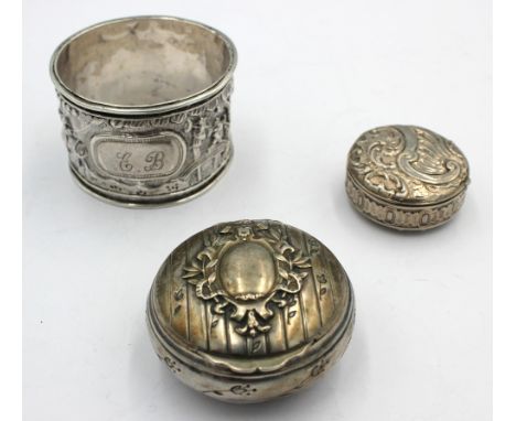 A 20th century Chinese silver circular napkin ring, with repousse figural and village scene, with initialled cartouche, marke