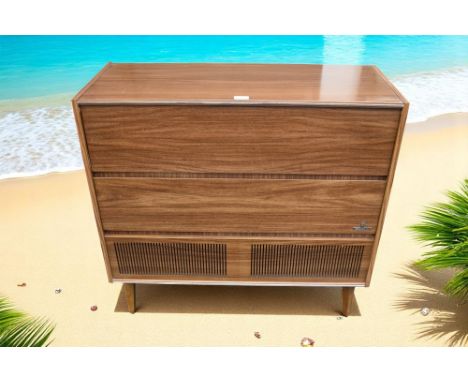 A 1960s Grundig double flapped KS715 GB radiogram. MADE IN GERMANY 1967/1968  With extra spare parts and origional instructio