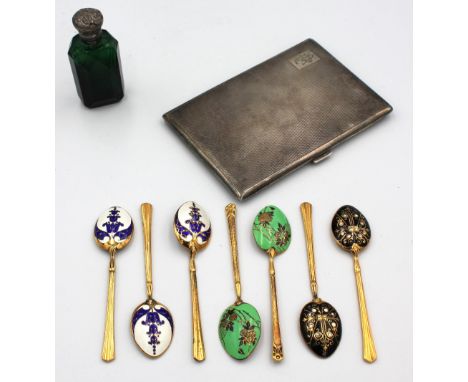 A collection of silver to include; a George VI engine turned silver cigarette case, engraved with initials and with gilt inte