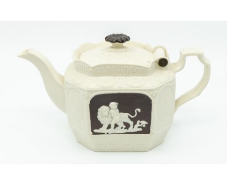 A Castleford-type Yorkshire feldspathic stoneware teapot with hinged cover with moulded relief medallions and swags and centr