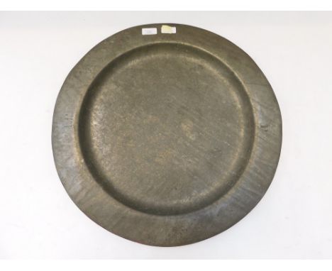 A 17th / 18th century pewter charger, of plain design and traditional circular shape, the border initialled LP under a crown 