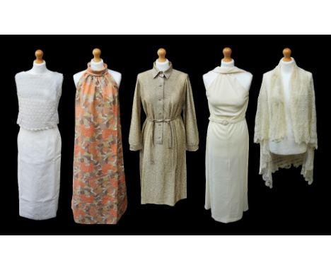 A off white crimpolene ankle length dress from the 1970s, cut away sleeves, zip up front and rabbit ears collar.&nbsp; A earl