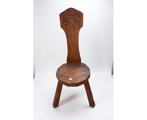 A vintage oak Thomas Whittaker Gnomeman stick chair in the arts &amp; crafts style.