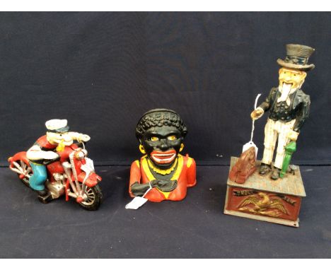 A novelty 20th century reproduction painted cast metal "Uncle Sam" money bank; a painted cast metal figural money bank, and a