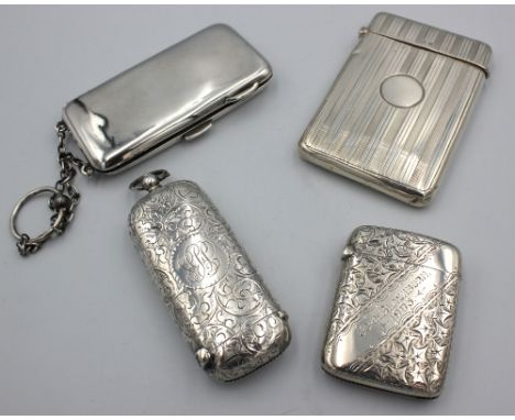 An Edwardian silver combined sovereign holder and vesta case, of oblong shape with engraved foliate and floral design, with i