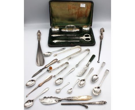 A collection of mixed silver to include; a pair of George III silver sugar tongs with engraved decoration; a pair of pierced 