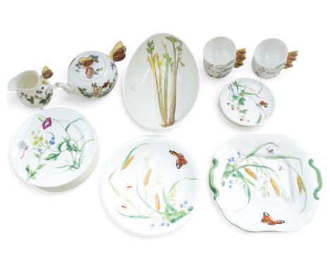 A 19th century Minton part dinner/tea service decorated with flowers and insects, pattern B199, and moulded 'butterfly' handl