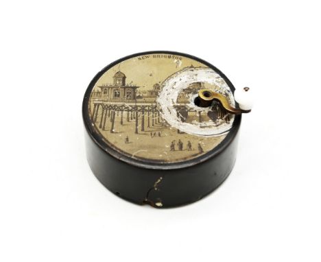 A novelty late 19th century circular portable music box, with transfer printed scene of New Brighton to top and winder, appro