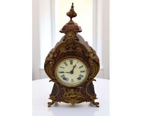 An ornate 19th Century French mahogany bracket clock, 8 day movement, round dial with Roman numerals, gilt detail finish, wit