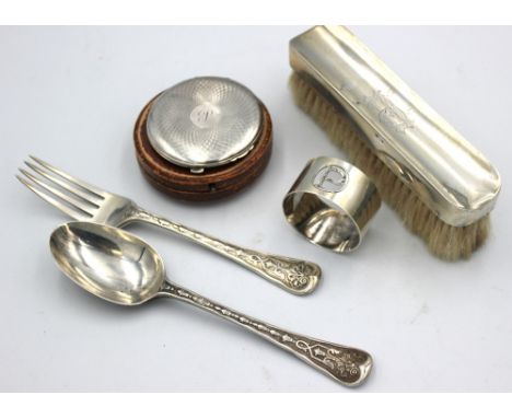 A small selection of silver comprising: a matched Victorian silver dessert spoon and fork, with elaborate engraved and chased